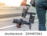 Videographer with gimbal video camera dslr, Professional video equipment, Videographer in event film production shoot video.