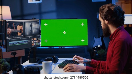 Videographer uses editing software on green screen computer to assemble footage into cohesive final result, with expert color correcting clips on mockup monitor to ensure project meets desired.