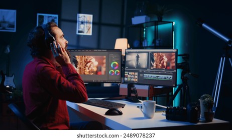 Videographer uses software to create visual effects for video projects while relaxing with some music. Professional wearing headphones using post production techniques to edit raw footage