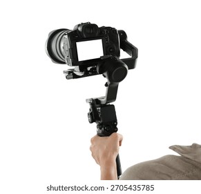 Videographer using gimbal stabilizer with camera on white background, closeup
