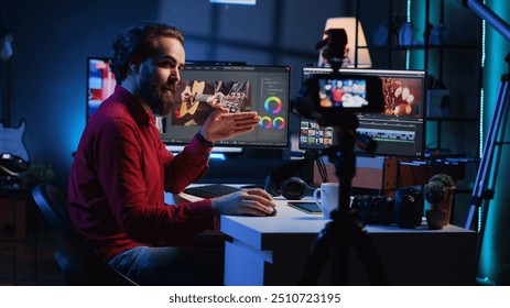 Videography content creator recording tutorial using professional camera, talking with audience about elevating video quality with skillful editing techniques. Media production influencer films guide