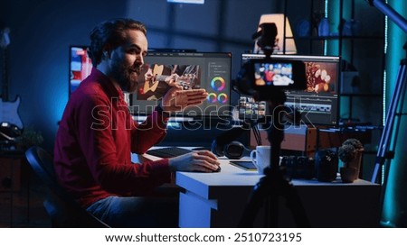 Videography content creator recording tutorial using professional camera, talking with audience about elevating video quality with skillful editing techniques. Media production influencer films guide