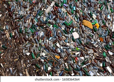 Vidraru Dam / Romania - 07.01.2016: A Layer Of Garbage, Litter -  Plastic Bottles Patch Floating On Water.