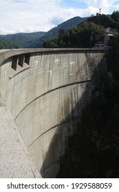 VIDRARU, ROMANIA - Sep 21, 2014: Vidraru huge dam wall in Romania with forest background