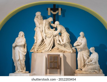 VIENNA, AUSTIRA - JULI 5, 2021: The the baroqwue craved sculptural group of Deposition of the Cross in the church Ulrichskirche from end of 18. cent. 