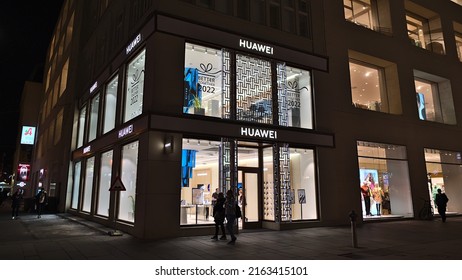 Vienna, Austria - 03-17-2022: View Of A Flagship Store Operated By Chinese Company Huawei Technologies In The Downtown Of Vienna, Austria At Popular Shopping Street Kärntner Straße By Night.