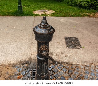 Vienna, Austria - 06.13.2022: Retro Borehole Pump On A Sunny Day, Old Manual Water Pump.