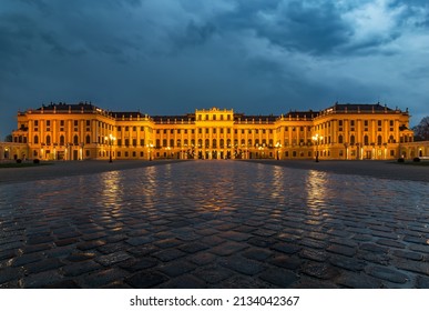 Vienna, Austria - April 13th 2016: Frontal Shot Of The Schönbrunn Palace In Vienna During Eveing After Rain With Dramatic Clouds