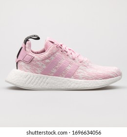 VIENNA, AUSTRIA - AUGUST 14, 2017: Adidas NMD R2 pink and white sneaker on white background.