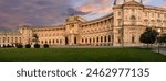 Vienna, Austria, August 17, 2022. Magnificent view of the Hofburg Imperial Palace at sunset, the warm evening light enhances the imposing facade. Large format shot.