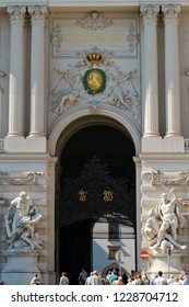 Vienna, Austria - August 22 2018: The Main Entrance Or “St. Michael” Gate Of The Hofburg Imperial Palace With The Gold Letters Representing The Names Of Emperor Francis I And Maria Theresia