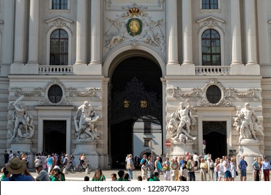 Vienna, Austria - August 22 2018: The Main Entrance Or “St. Michael” Gate Of The Hofburg Imperial Palace With The Gold Letters Representing The Names Of Emperor Francis I And Maria Theresia