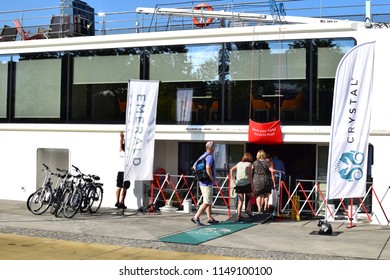 VIENNA, AUSTRIA - AUGUST 3, 2018: Passengers Go On Board A River Cruise Ship In Vienna