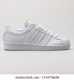 VIENNA, AUSTRIA - FEBRUARY 19, 2018: Adidas Superstar 80s HH White And Red Sneaker On White Background.