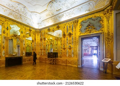 VIENNA, AUSTRIA - JANUARY 30, 2022: Impressive interior of Golden room in Lower Belvedere Palace with gold walls decorated with stucco, giant mirrors and grotesque paintwork