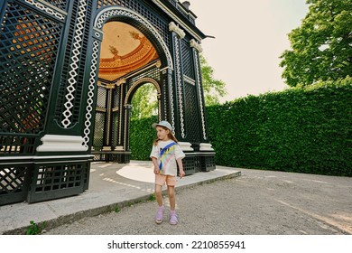 Vienna, Austria - May 17, 2022: Baby Girl Under Wooden Arbor Arch At Schonbrunn Palace In Vienna, Austria.