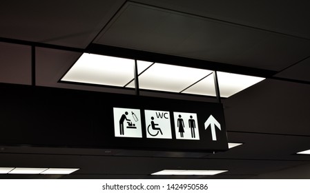 Vienna, Austria: May/20/2019 - Vienna International Airport (built In 1938 And The Largest Airport In Austria). Direction And Navigation Signs In The Terminal Hall For WC For Disabled And Nursing Room