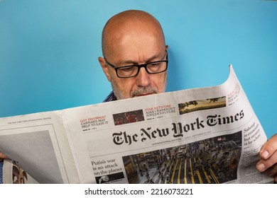 Vienna, Austria. September 2022.  A Man Reading The New York Times Newspaper