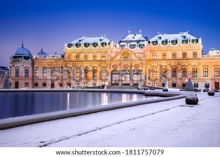 Vienna, Austria. Upper Belvedere snowy winter night reflection, Wien austrian travel background.