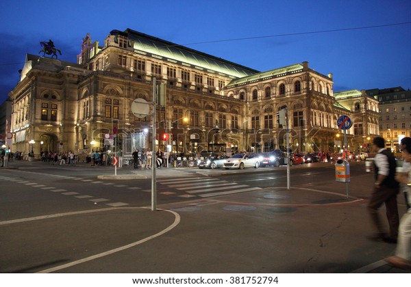 VIENNA AUSTRIA-JULY 4: Ten thousands of visitors\
from abroad congest the city centre of Vienna between the\
Stephansdom and the Hofburg on July 4, 2014 in Vienna. Vienna\'s\
State Opera House at\
night.