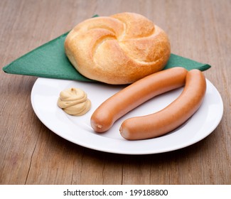 Vienna Sausage, Roll And Mustard On A Plate