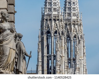 VIENNA/AUSTRIA-MAY 1, 2018: Statues On One Side Of The Beautiful Vienna City Hall Building; View Of The Votive Church