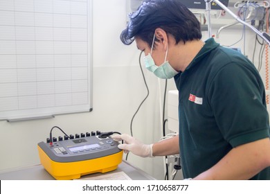 Vientiane / Laos - April 16, 2020: Biomass Engineer Preparing Analyzer For Electrical Safety Test In Hospital, It Is Use For Analyzing Medical Equipment To Unsure The Safety Use To Patients And Users.