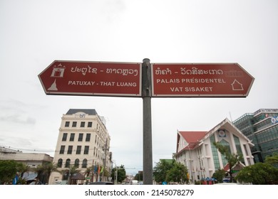 VIENTIANE, LAOS - AUGUST 20 : Direction sign pole to Patuxai, It's a war monument. The Patuxai is dedicated to those who fought in the struggle for independence from France on Aug 20, 2011