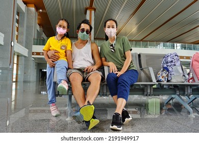 VIENTIANE, LAOS – JULY 11, 2022: The Asian Family Sitting On A Chair In The Building At Railway Station In Vientiane Of Laos.A New Destinations Of Tourism And Logistics Business.