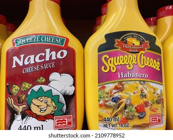 Viersen, Germany - January 9. 2022: Closeup Of Bottles Nacho And Habanero Squeeze Cheese  In Shelf Of German Supermarket (focus On Cneter Of Right Bottle Label)