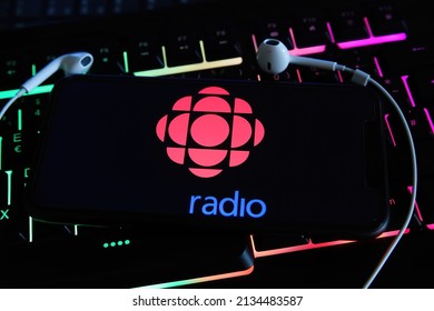 Viersen, Germany - January 9. 2022: Closeup of mobile phone with logo of canadian radio station cbc on computer keyboard (focus on center of red logo)