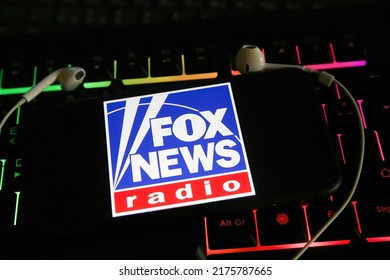 Viersen, Germany - January 9. 2022: Closeup Of Mobile Phone With Logo Of Fox News Radio Station On Computer Keyboard 