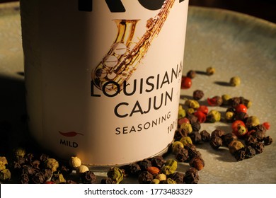 Viersen, Germany - July 8. 2020: View On Isolated Can With Louisiana Cajun Spice And Herb Mix And Peppercorns On Plate. (Focus On Lettering)