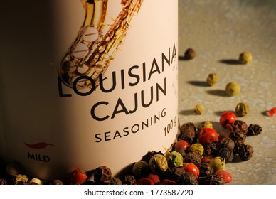 Viersen, Germany - July 8. 2020: View On Isolated Can With Louisiana Cajun Spice And Herb Mix And Peppercorns On Plate. (Focus On Lettering)