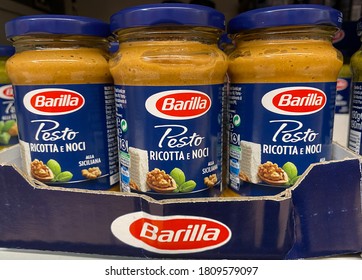 Viersen, Germany - July 9. 2020: View On Glasses Barilla Noodle Pesto In Shelf Of German Supermarket (focus On Glass In Center)