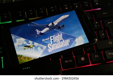 Viersen, Germany - May 9. 2021: Closeup Of Smartphone With Logo Lettering Of Microsoft Flight Simulator Game On Computer Keyboard (focus On Center Of Word Flight)