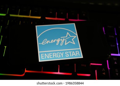 Viersen, Germany - May 9. 2021: Closeup Of Smartphone With Logo Lettering Of Energy Star Label Mark On Computer Keyboard (focus On Center Of Upper Lettering)