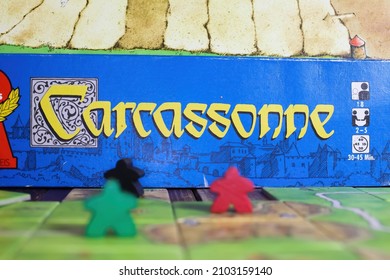 Viersen, Germany - May 9. 2021: Closeup Of Tile Based Original Strategy Board Game Carcassonne (selective Focus On Center Of Yellow Lettering) 