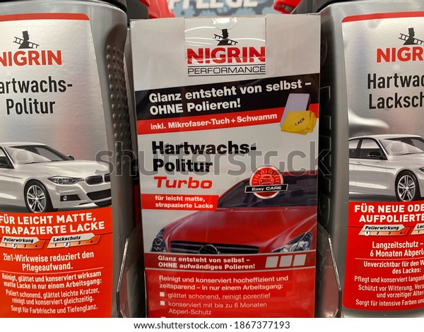 Viersen, Germany - November 9. 2020: Close up of\
boxes Nigrin car care hard wax polish in shelf of german store\
(focus on center of central\
box)