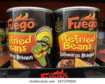 Viersen, Germany - October 8. 2020: Close Up Of Fuego Refried Black Beans Cans In Shelf Of German Supermarket (focus On Center Of Right Can)