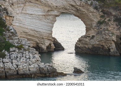 Vieste, San Felice arch and its bay. The Natural Arch of San Felice is the most famous natural monument in the Gargano, Puglia, Italy - Shutterstock ID 2200541011