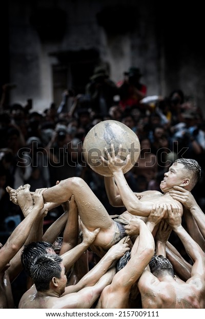 Viet Yen province,Vietnam - May 13, 2022:\
Traditional mud wrestling festival, held once every 4 years,\
praying for favorable rain and wind in Yen Vien village, Van Ha\
commune, Viet Yen district