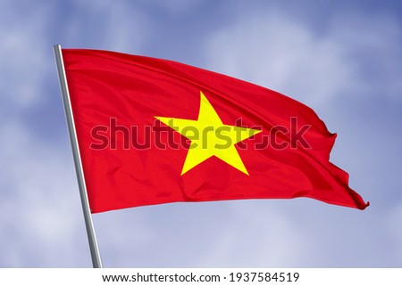 Vietnam flag isolated on sky background. close up waving flag of Vietnam. flag symbols of Vietnam.