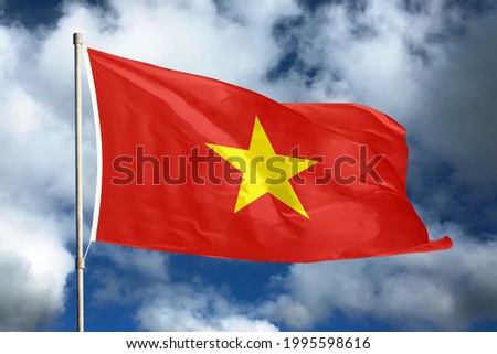 Vietnam flag on sky and cloud background. National symbols of Vietnam. Flag of Vietnam.