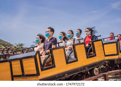 Vietnam, Nha Trang, 24.05.2020: People In Medical Masks Ride In An Amusement Park Vinpearl Because Of A Coronovirus Pandemic COVID 19