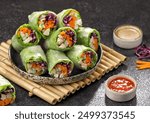 Vietnam Spring Roll. Vietnamese spring rolls, summer spring rolls, or salad spring rolls, a traditional dish in Vietnamese cuisine consisting of pork, shrimp, vegetables, bún, and other ingredients wr