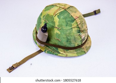 Vietnam Vet Camouflage Helmet With Small Water Bottle