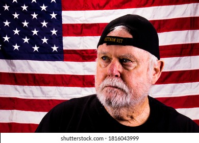 Vietnam Vet Looking Away In Front Of American Flag