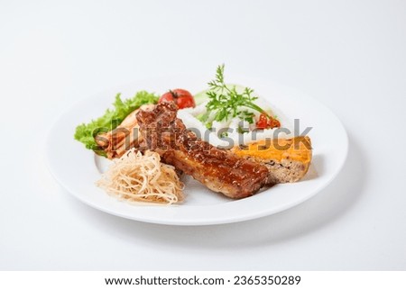Vietnamese Broken Rice is served with grilled pork, also known as 