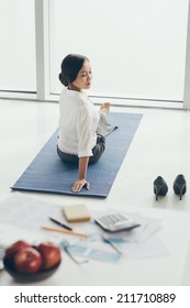 Vietnamese Business Woman Practicing Yoga Before Work